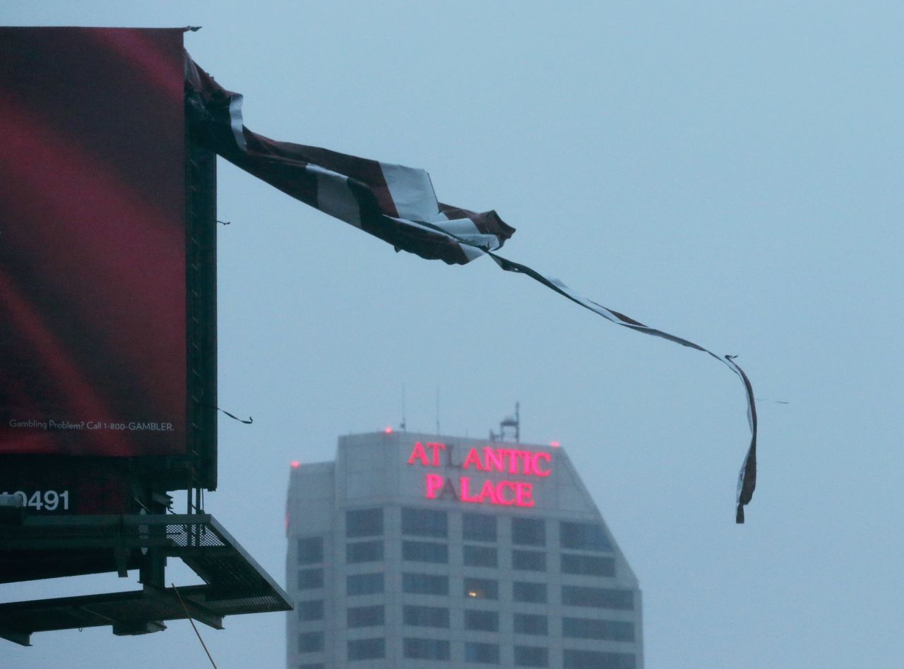 A tattered piece of a billboard blows in the wind Monday in Atlantic City, New Jersey.  