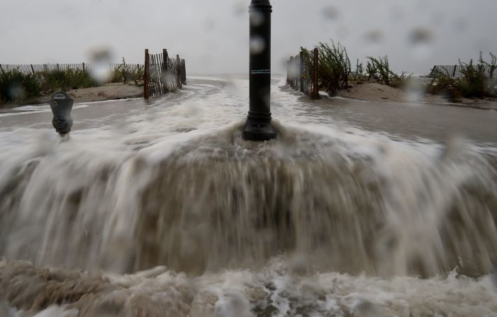 Water forced ashore ahead of the hurricane starts to flood Beach Avenue in Cape May on Monday morning.