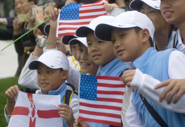 Young fans show their support for McIlroy and Woods in a country that is seen as the next great market for golf to conquer.