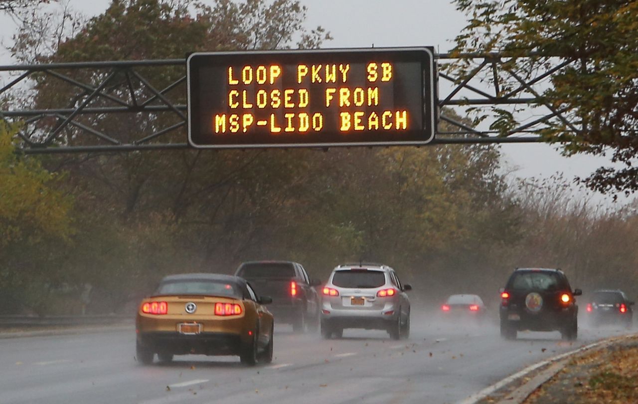 An overhead sign on the Southern Parkway alerts motorists to road closings in Wantagh, New York, on Monday.