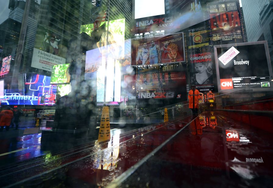 A security guard looks over Times Square on Monday.