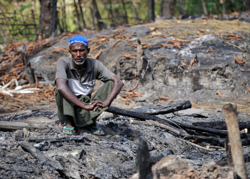 A Muslim Rohingya man sits at the site of his burnt-out home at a village in Minpyar in Rakhine state on Sunday.The U.N. said it seen "large-scale" destruction of houses. 