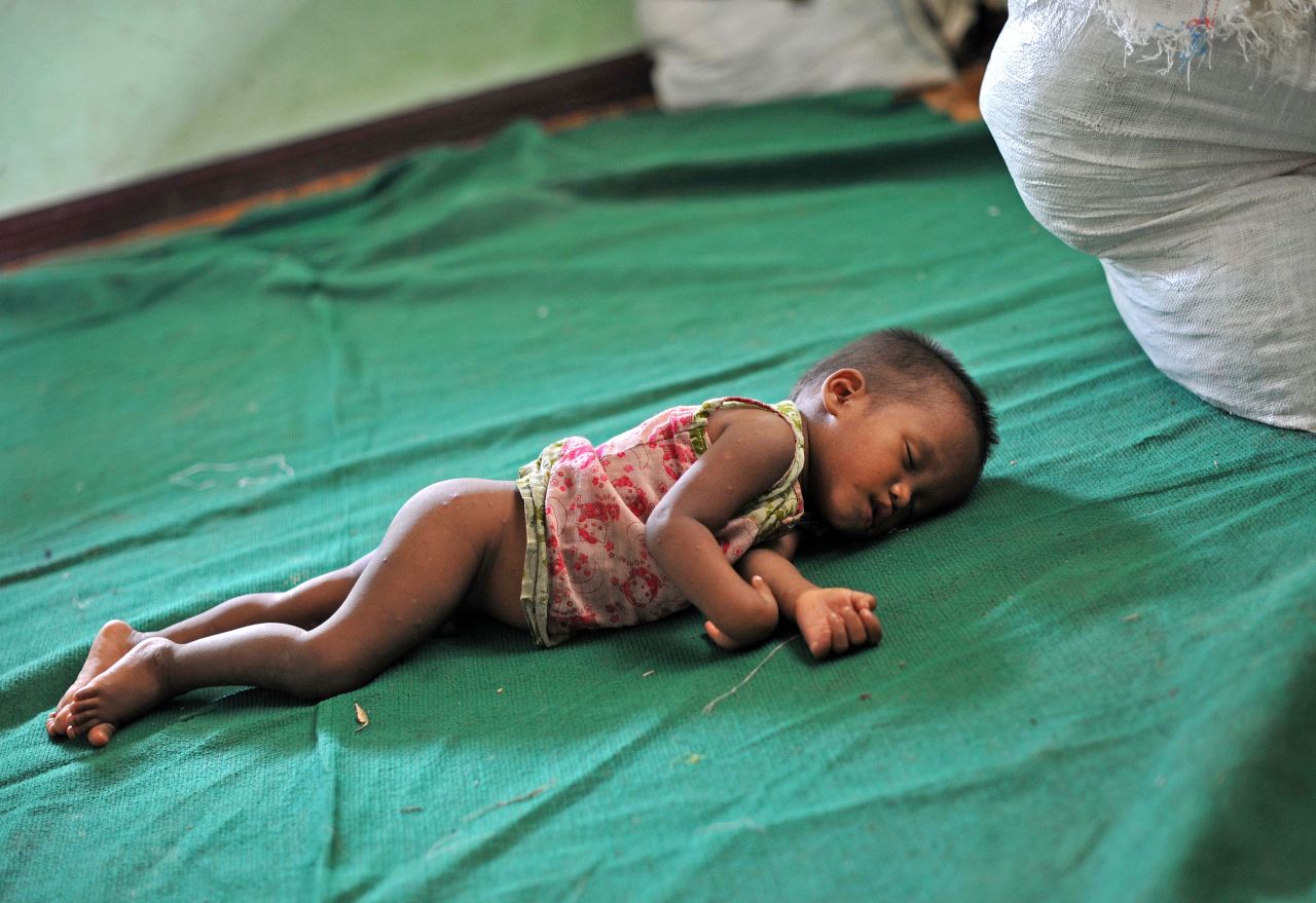 A baby sleeps at a refugee camp in Mrauk U in Myanmar on Sunday. The U.N. is already assisting 75,000 people forced to flee earlier this year when violence first erupted in western Myanmar.