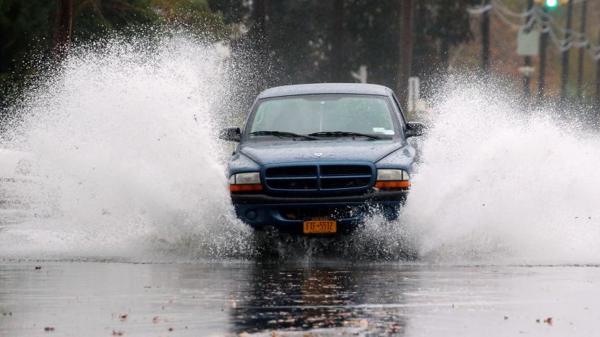 Hurricane Sandy combine to flood the area on October 29, 2012 in Freeport, New York. The storm, which threatens 50 million people in the eastern third of the U.S., is expected to bring days of rain, high winds and possibly heavy snow.