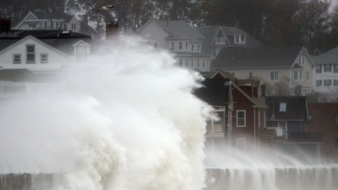 Waves crash over a street in Winthrop, Massachusetts, as Hurricane Sandy comes up the coast on Monday.