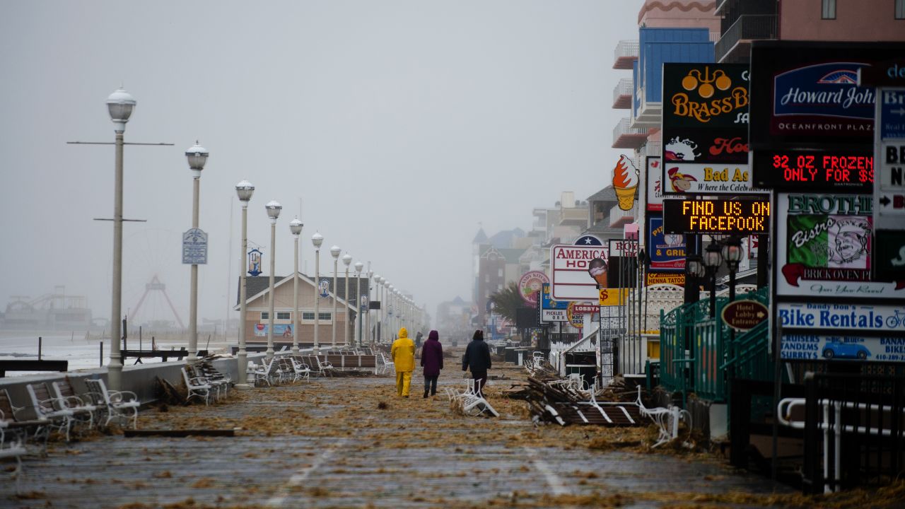 People walk on the boardwalk in Ocean City, Maryland, on Monday.