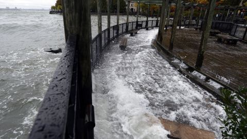 The Hudson River comes over the sea wall along the West Side Promenade in the Battery Park area in New York on Monday.