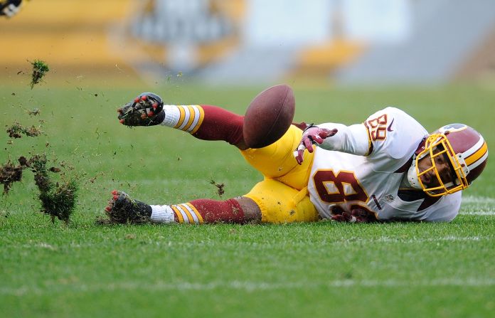 Santana Moss of the Washington Redskins loses control of a pass during the fourth quarter against the Pittsburgh Steelers on Sunday, October 28, in Pittsburgh.