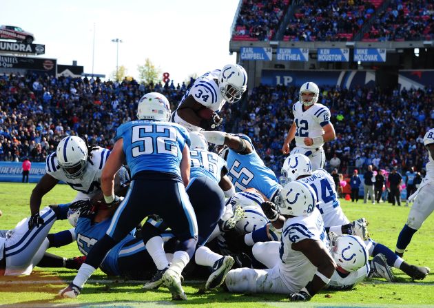 Colts No. 34 Delone Carter dives over a pileup for a touchdown on Sunday.