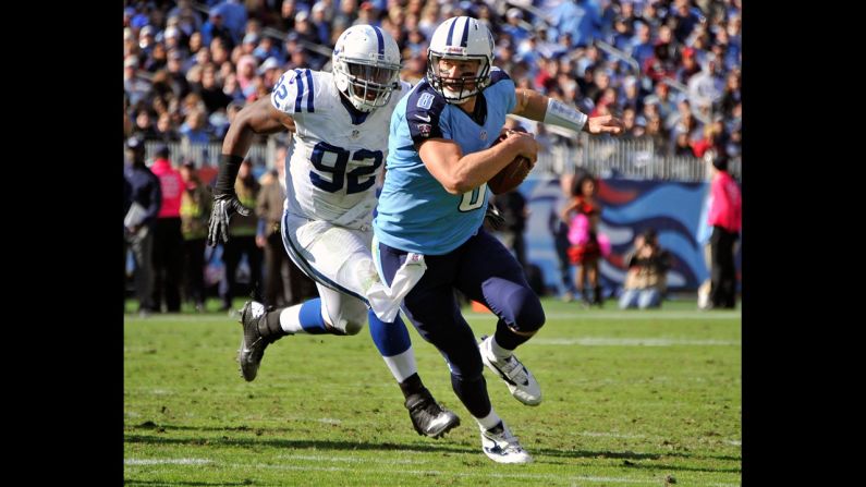 Titans quarterback Matt Hasselbeck is pressured by the Colts' Jerry Hughes during Sunday's game.