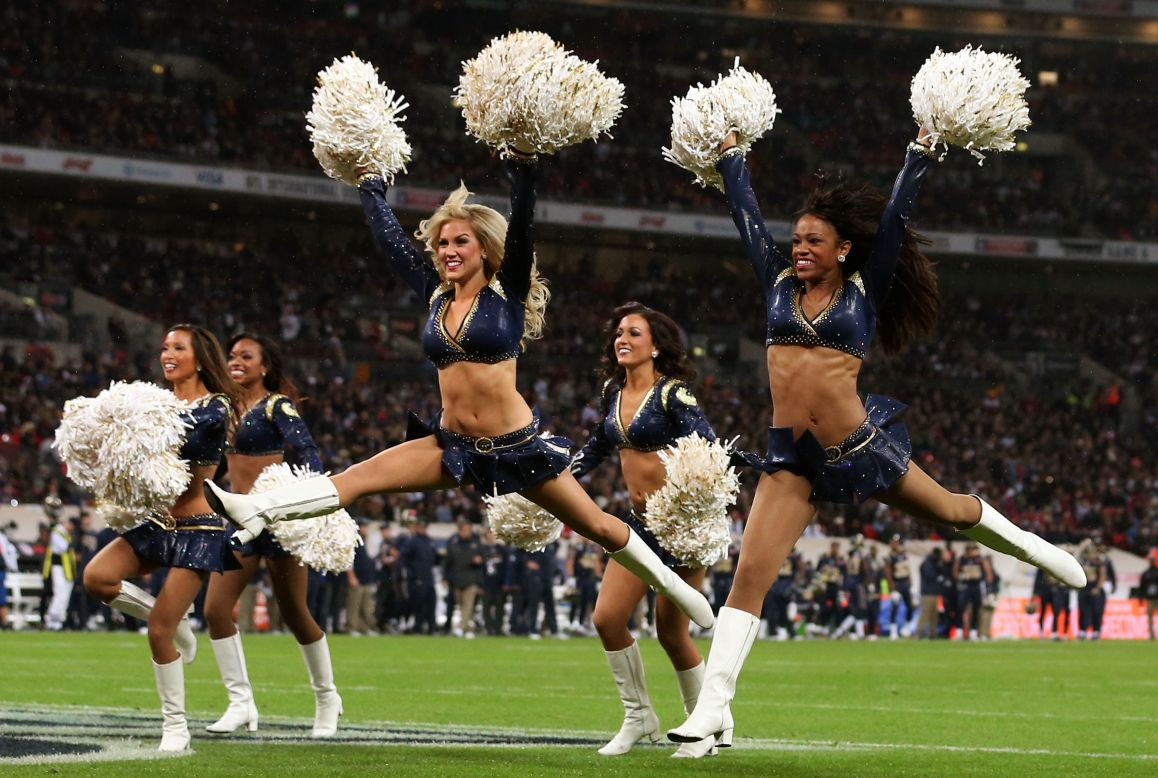 The St.Louis cheerleaders, however, were proving a big hit with the sellout crowd of 84,000 fans on a cold, wet day in London. 