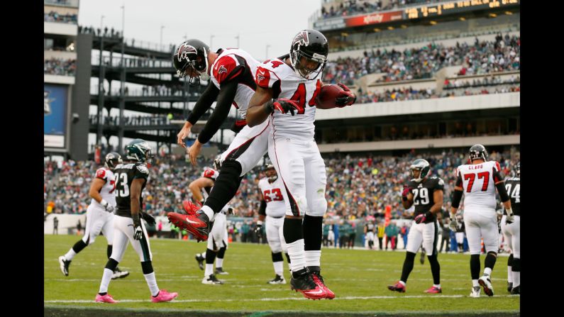 Falcons No. 44, fullback Jason Snelling, and No. 2, quarterback Matt Ryan, celebrate on Sunday after a first quarter touchdown.