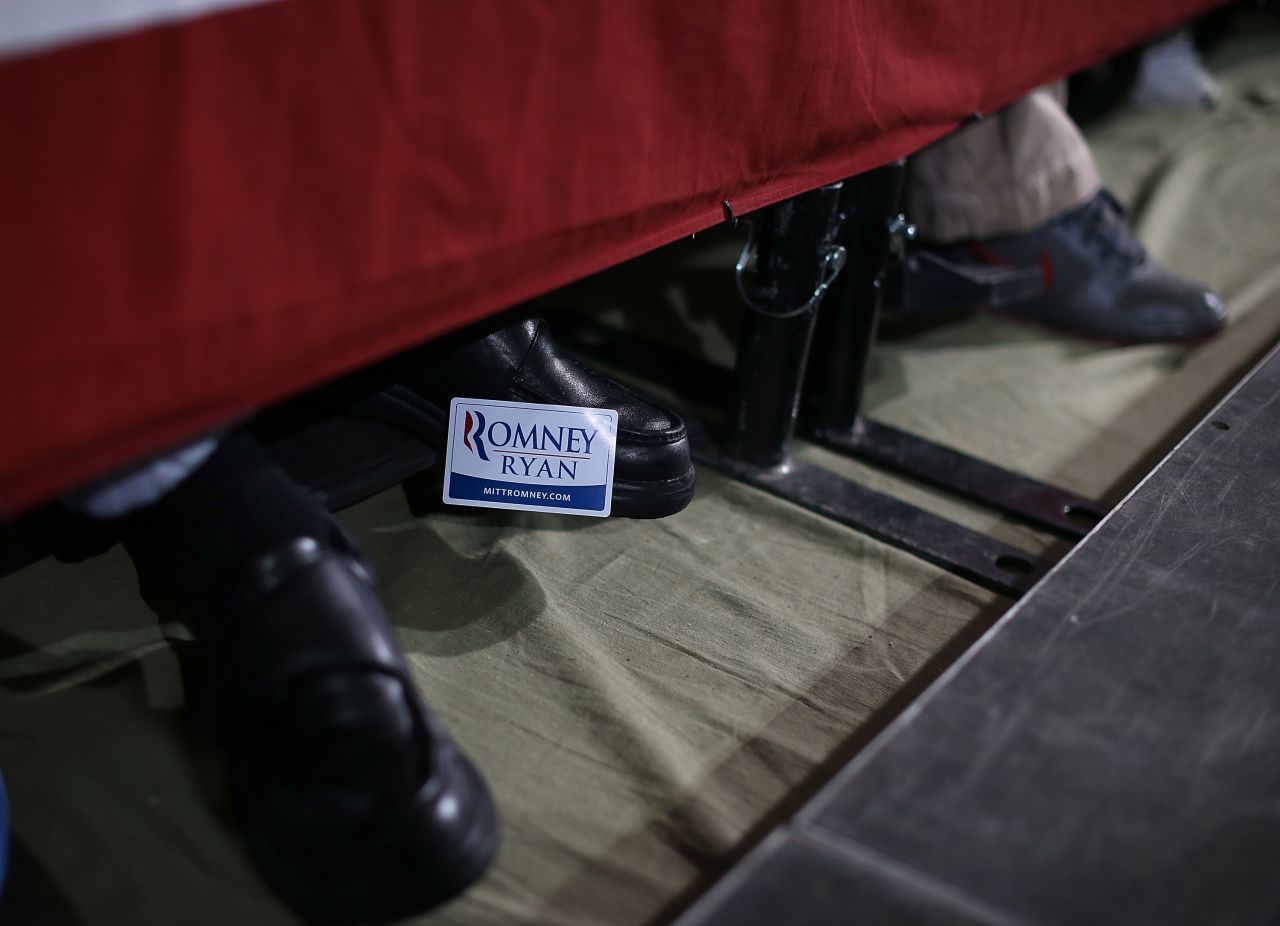 A supporter of Mitt Romney and Paul Ryan wears a campaign sticker on his shoe during a campaign rally at the Celina Fieldhouse in Celina, Ohio, on Sunday, October 28.
