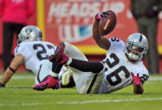 Defensive back Pat Lee of the Oakland Raiders reacts after intercepting a pass against the Kansas City Chiefs during the fourth quarter on Sunday at Arrowhead Stadium in Kansas City, Missouri.