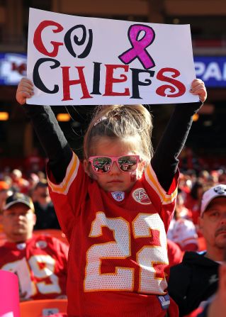 A young Chiefs fan holds a sign during the game.