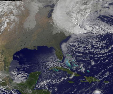 A satellite image shows Hurricane Sandy at 8:25 a.m. ET Monday. Forecasters warned that Sandy was likely to collide with a cold front and spawn a "superstorm" that could generate flash floods, snowstorms and massive power outages.