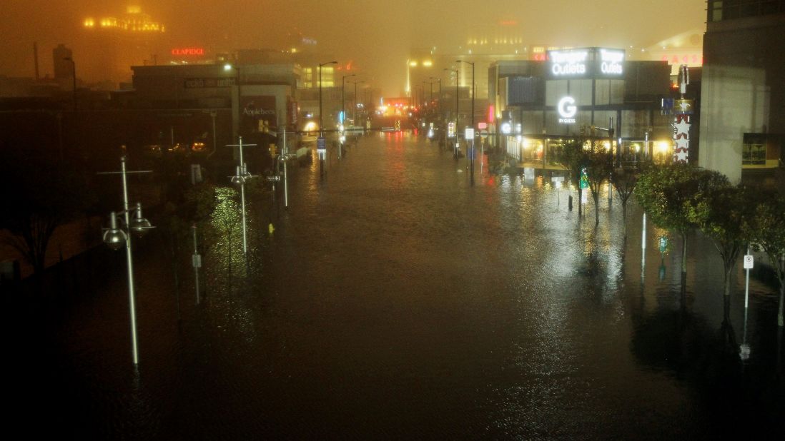 A flooded street is seen at nightfall during the storm on Monday in Atlantic City, New Jersey.