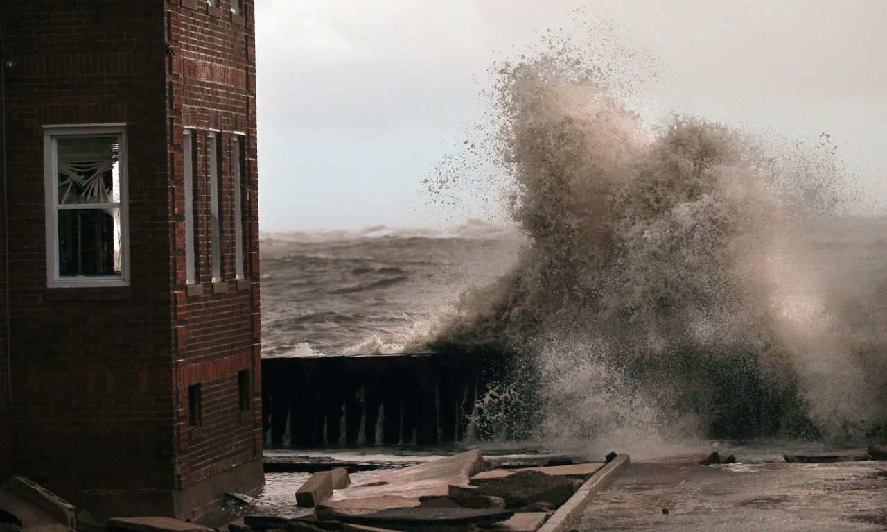 Waves break next to an apartment building in Atlantic City, New Jersey, on Tuesday. 