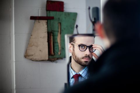 Chicagoan Joel Axelrod tries on handmade wood and acetate glasses by Drift, a Chicago-based eyewear company.
