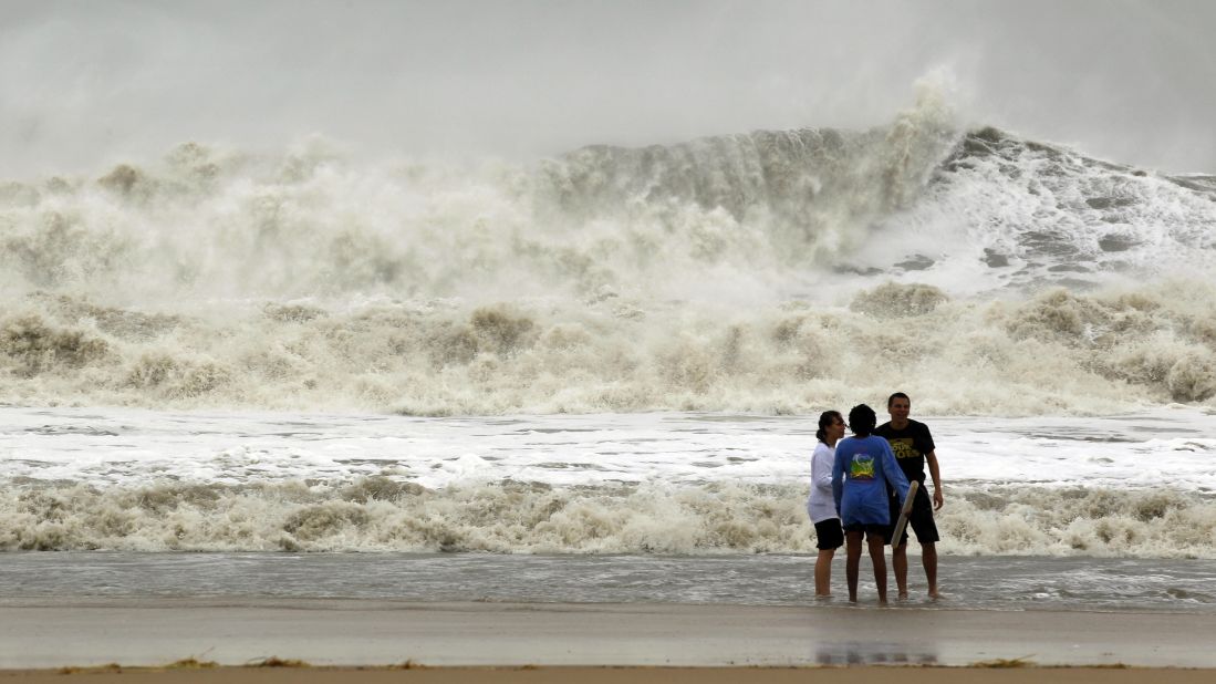 A wall of water makes its way to shore as residents brave the storm Monday in Ocean City, Maryland.