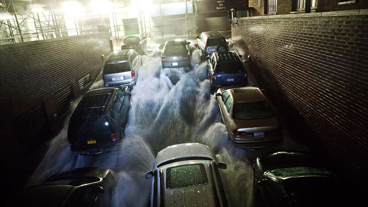 Rising water rushes into an underground parking garage in New York's financial district on Monday.