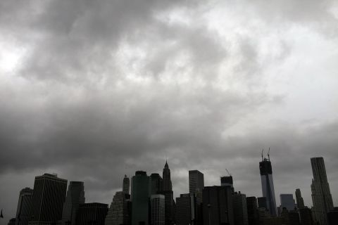 The Manhattan skyline remains dark after much of the city lost electricity in the storm.