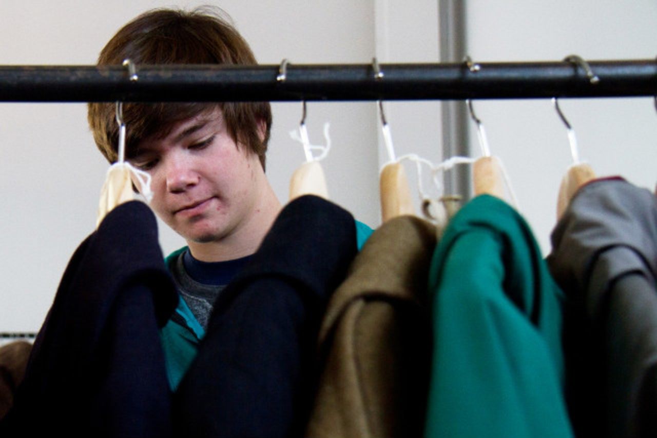 Nick Rokosz, 16, looks through vintage coats from MidNorth Mercantile.