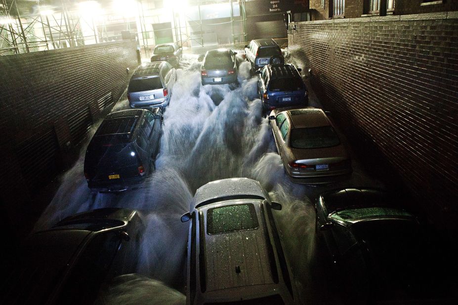 Rising water rushes into an underground parking garage in New York's financial district on Monday, October 29. 