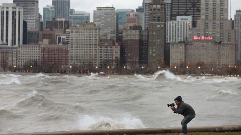  A photographer shoots waves in Lake Michigan generated from the remnants of Sandy in Chicago on Tuesday.