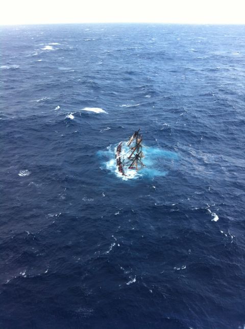 The HMS Bounty, a half-century-old 180-foot long wooden sailing ship, sank in Hurricane Sandy roughly 100 miles off Cape Hatteras, North Carolina. A U.S. Coast Guard aircraft captured this image of the ship moments before it went down.