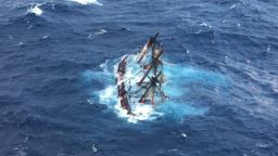 The HMS Bounty, a half-century-old 180-foot long wooden sailing ship, sank in Hurricane Sandy roughly 100 miles off Cape Hatteras, North Carolina. A U.S. Coast Guard aircraft captured this image of the ship moments before it went down.