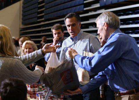 Republican presidential candidate Mitt Romney accepts a food donation for storm victims at an event in Kettering, Ohio, on Tuesday.