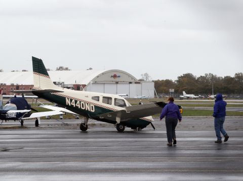 A small plane damaged in the storm sits on a runway in Farmingdale, New York, on Tuesday.