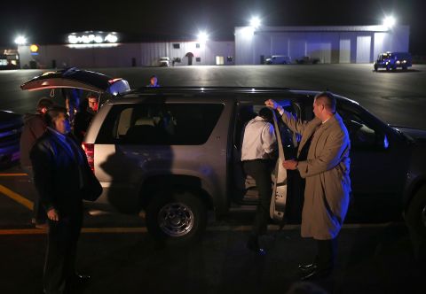 Romney gets into his SUV after landing Monday in Vandalia, Ohio.