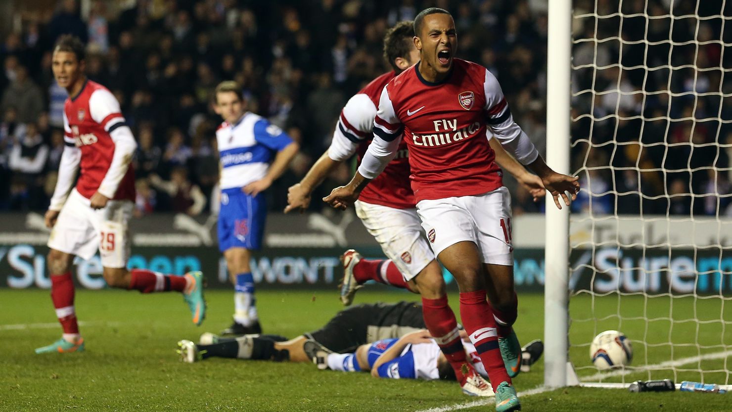Theo Walcott celebrates his third goal and Arsenal's sixth as the Gunners complete a remarkable comeback at Reading. 