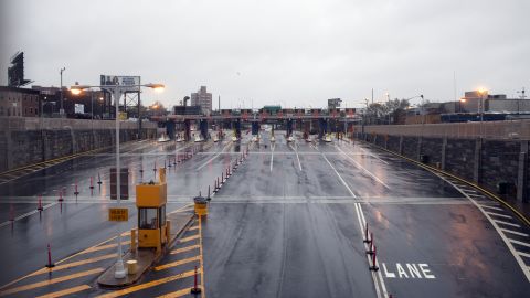 Empty toll booths remain closed on Monday at the Brooklyn Battery Tunnel in New York.