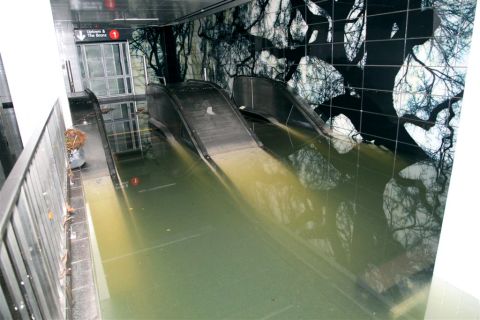 A subway station and escalator sit underwater in New York on Tuesday.