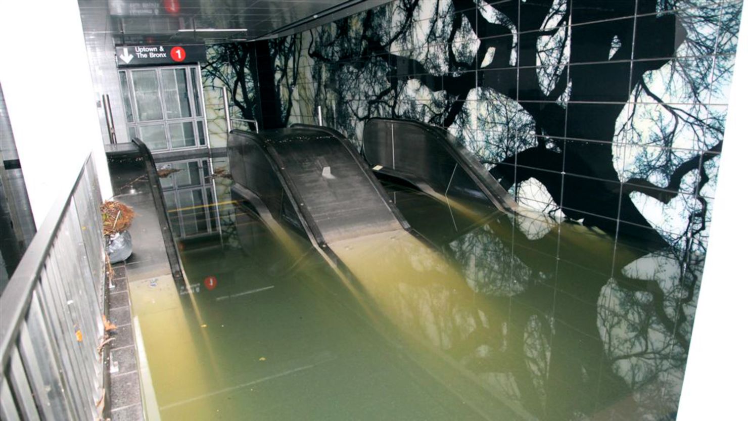 A subway station and escalator sit underwater in New York on October 30 in the aftermath of Superstorm Sandy.