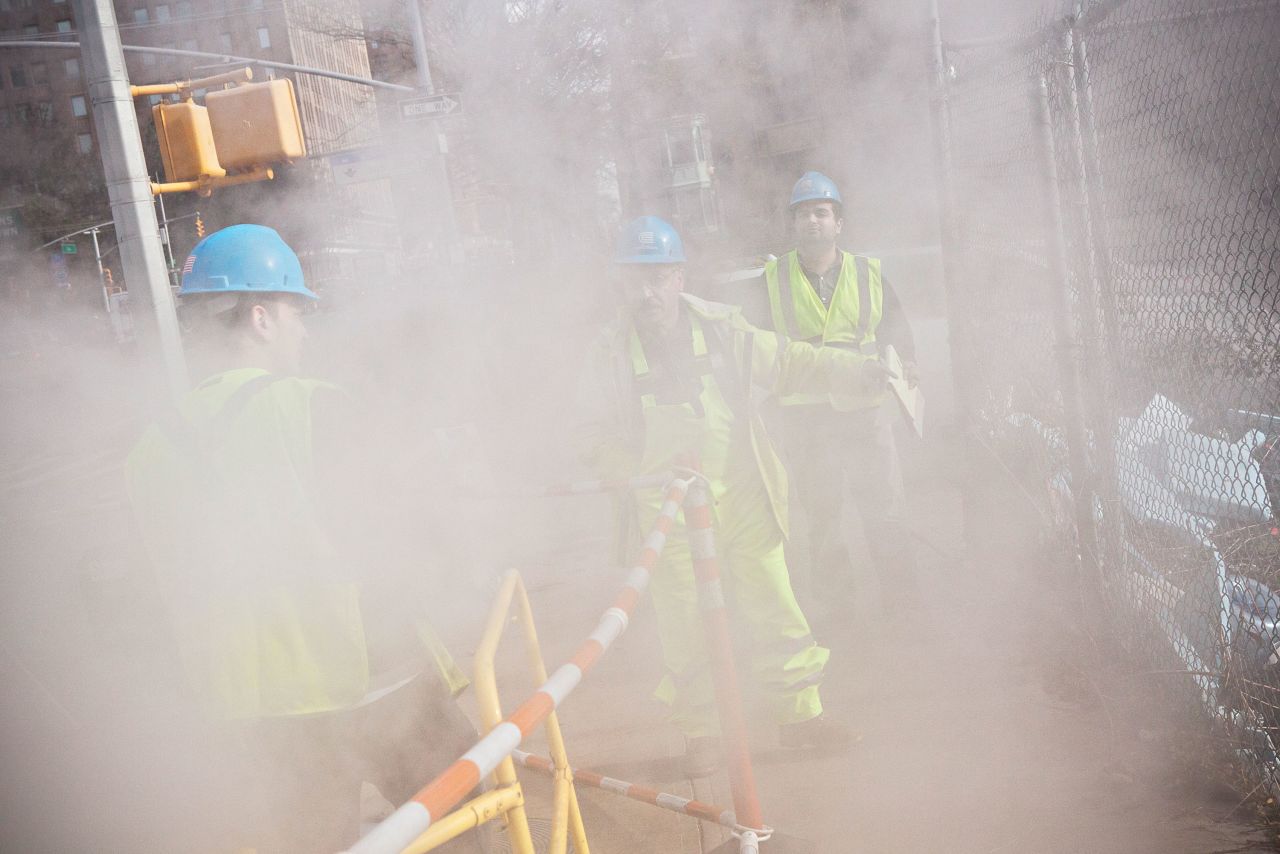 Con Edison crew members work on a steam pipe on First Avenue on Wednesday.