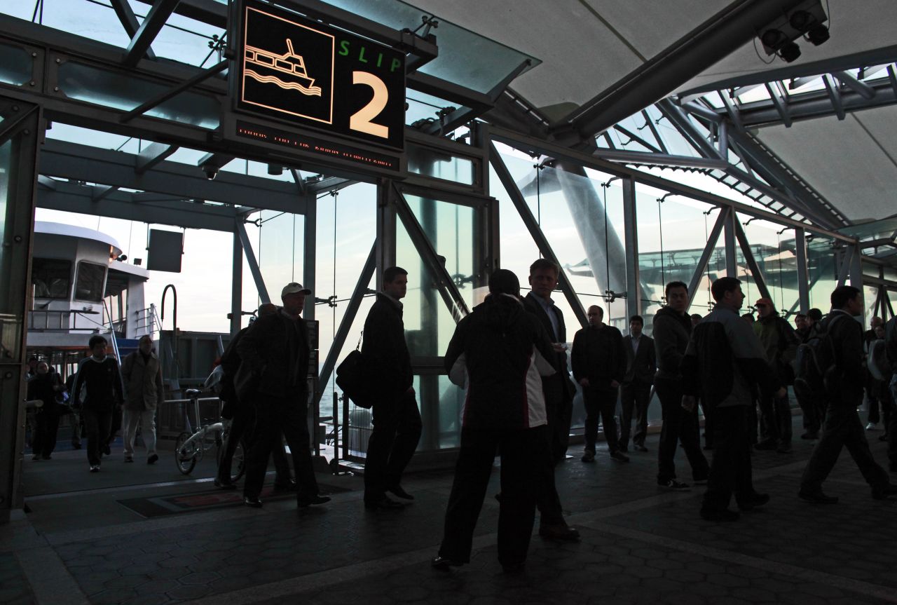 Commuters arrive in Manhattan by ferry from Jersey City, New Jersey, on its first day back in business after Sandy.