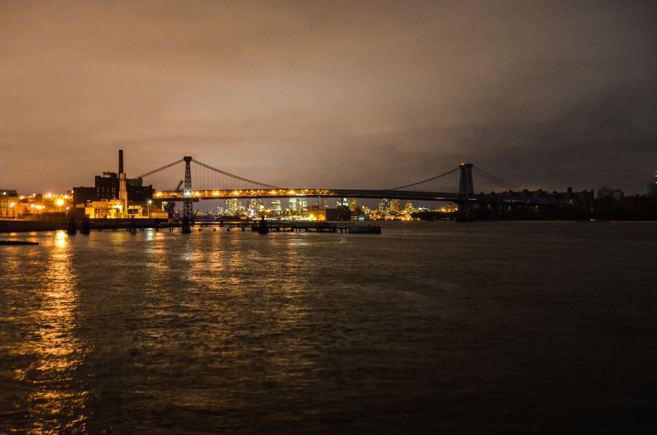 CNN iReporter Jordan Shapiro captured this view of the Williamsburg Bridge in New York at 11 p.m. on Tuesday, October 30. Half of the bridge and Brooklyn is lit, while the Manhattan side and the surrounding part of the island remain shrouded in darkness.