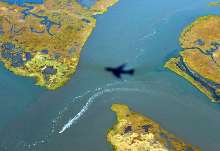 The shadow of Air Force One is cast on the water as it prepares to land in Atlantic City on Wednesday, October 31.