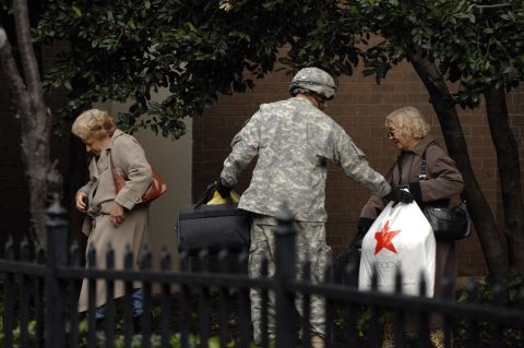 A member of  Army National Guard Unit Gulf 250 from Morristown, New Jersey, evacuates victims of Hurricane Sandy in Hoboken on Wednesday, October 31.