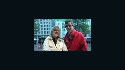 Lauren Ashburn and Howard Kurtz in the rain.