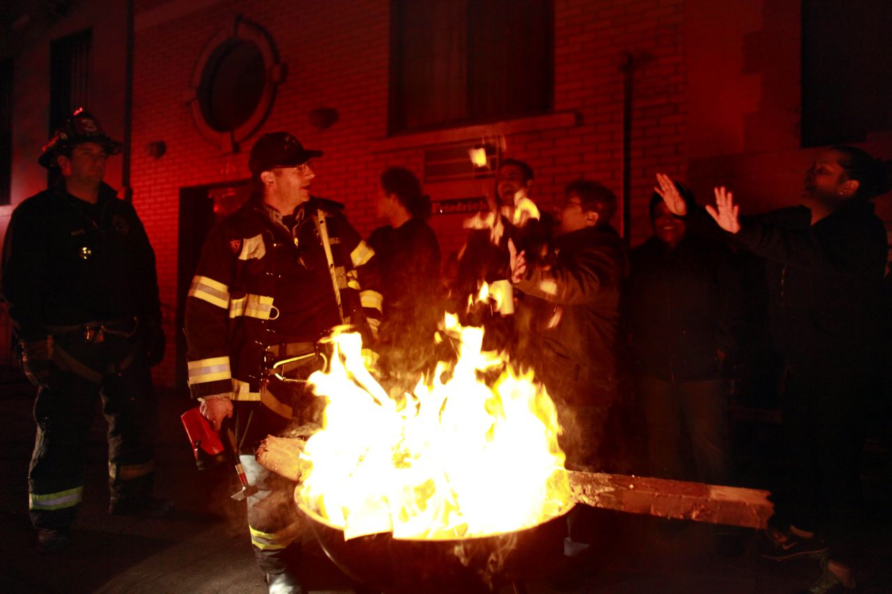Residents of New York City's East Village enjoy a bonfire on Wednesday, October 31.