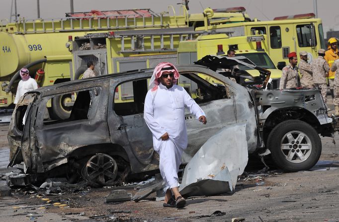 Saudi security forces inspect the destruction at the site where a gas tanker exploded on November 1, 2012.
