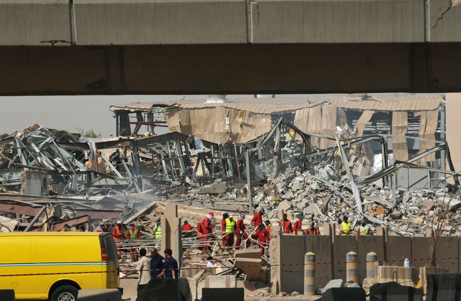 A destroyed factory is seen as Saudi rescuers inspect the site after a truck transporting gas exploded in Riyadh. 