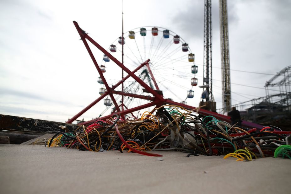 Amusement-park rides lie mangled on the beach after the Fun Town pier in Seaside Heights was destroyed.