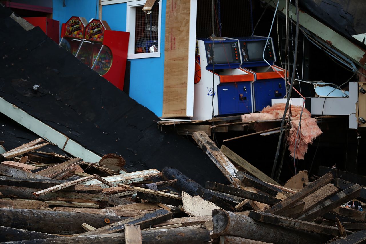 The arcade at the FunTown pier in Seaside Heights is in ruins. Storm damage is expected to cost tens of billions of dollars.