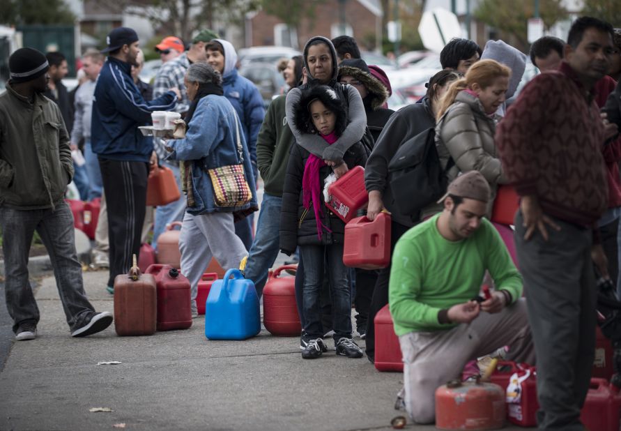 People wait in line for fuel at a Shell Oil station onThursday in Fort Lee, New Jersey. Fuel shortages have led to long lines of cars at gasoline stations in many states.